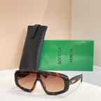 Bottega Veneta sunglasses with dark tortoiseshell frame and warm brown lenses, black case