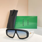 Bottega Veneta sunglasses with black frame and light blue-tinted lenses, black case