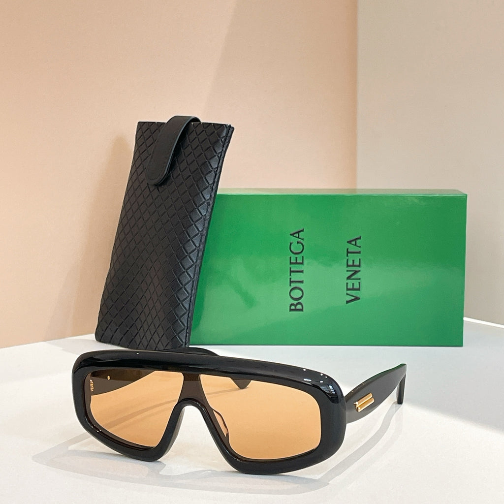 Bottega Veneta sunglasses with dark tortoiseshell frame and amber-tinted lenses, black case