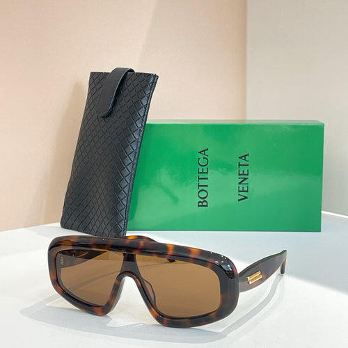 Bottega Veneta sunglasses with dark tortoiseshell frame and brown lenses, with black case