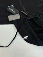 Balenciaga black hoodie front close-up with zipper, hood cord, and tag