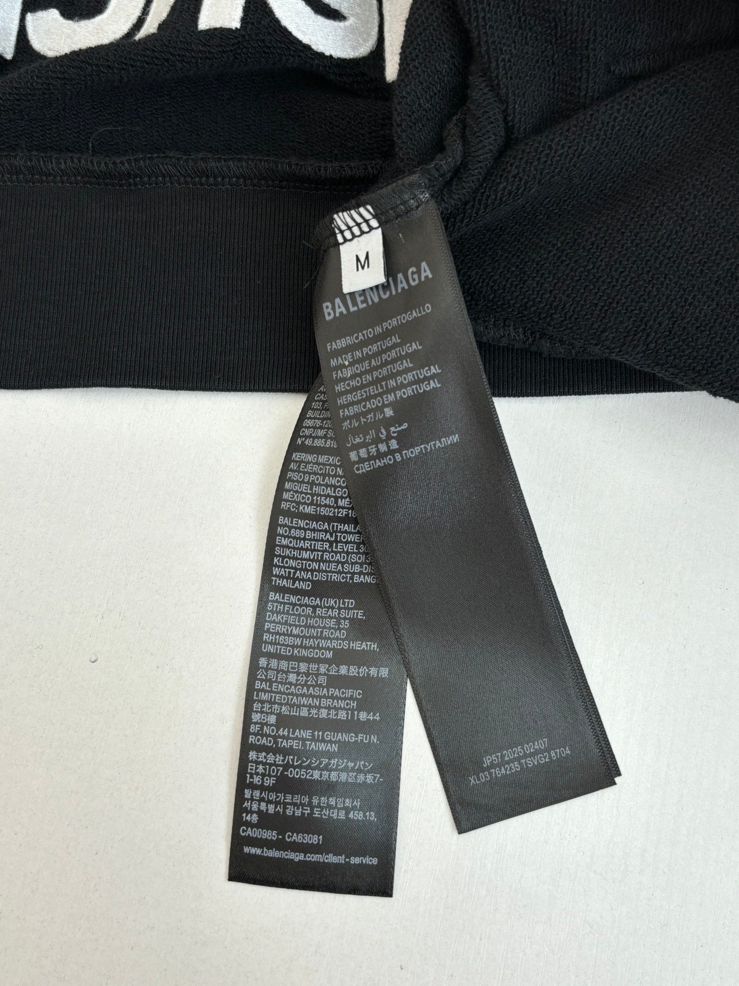 Balenciaga top interior care tags at neckline