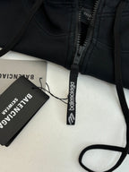 Balenciaga black hoodie zipper close-up with woven neck and logo tag