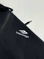 Balenciaga black hoodie sleeve with white balenciaga logo emblem