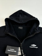 Balenciaga black hoodie close-up of hood, front zip, and neck label