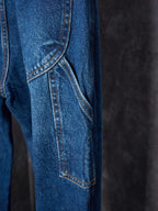 Louis Vuitton blue denim pants close-up of front panel seam and pocket detail