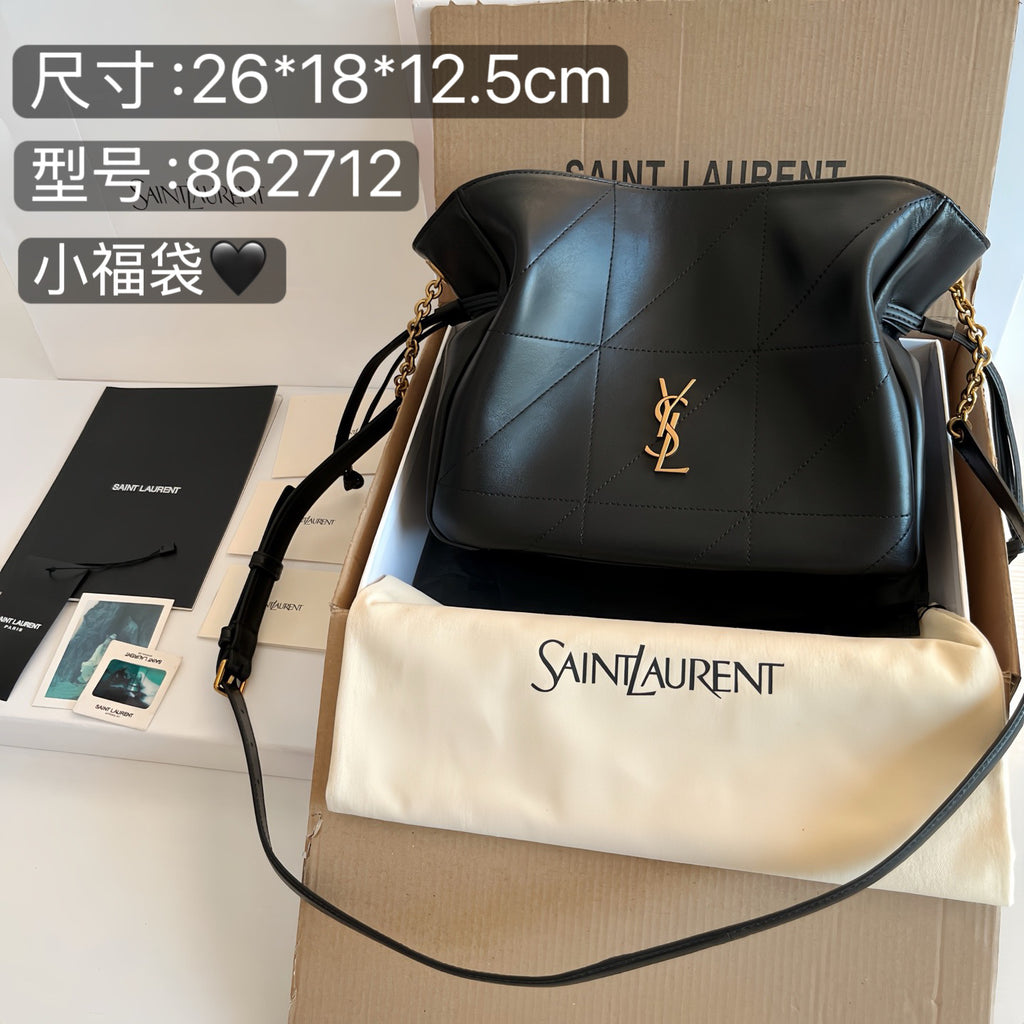 Saint Laurent small hobo bag in black and cream, gold YSL logo, chain strap
