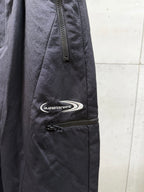 Balenciaga dark pants with side zipper pocket and oval logo patch