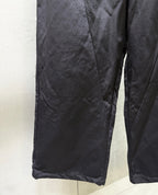 Balenciaga dark pants with stitched seam details and roomy leg opening