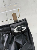 Balenciaga black pants with elastic waistband and Balenciaga logo patch on pocket