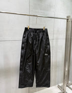 Balenciaga black wide-leg pants with elastic waistband and side pockets