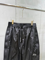 Balenciaga black pants with elastic waistband, front drawstring, and side zip pockets