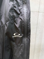 Balenciaga black cargo-style pants with front seam and embroidered logo patch