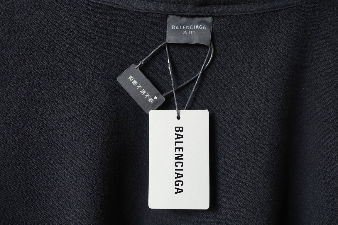 Black hooded sweatshirt with Balenciaga brand hang tag and collar.