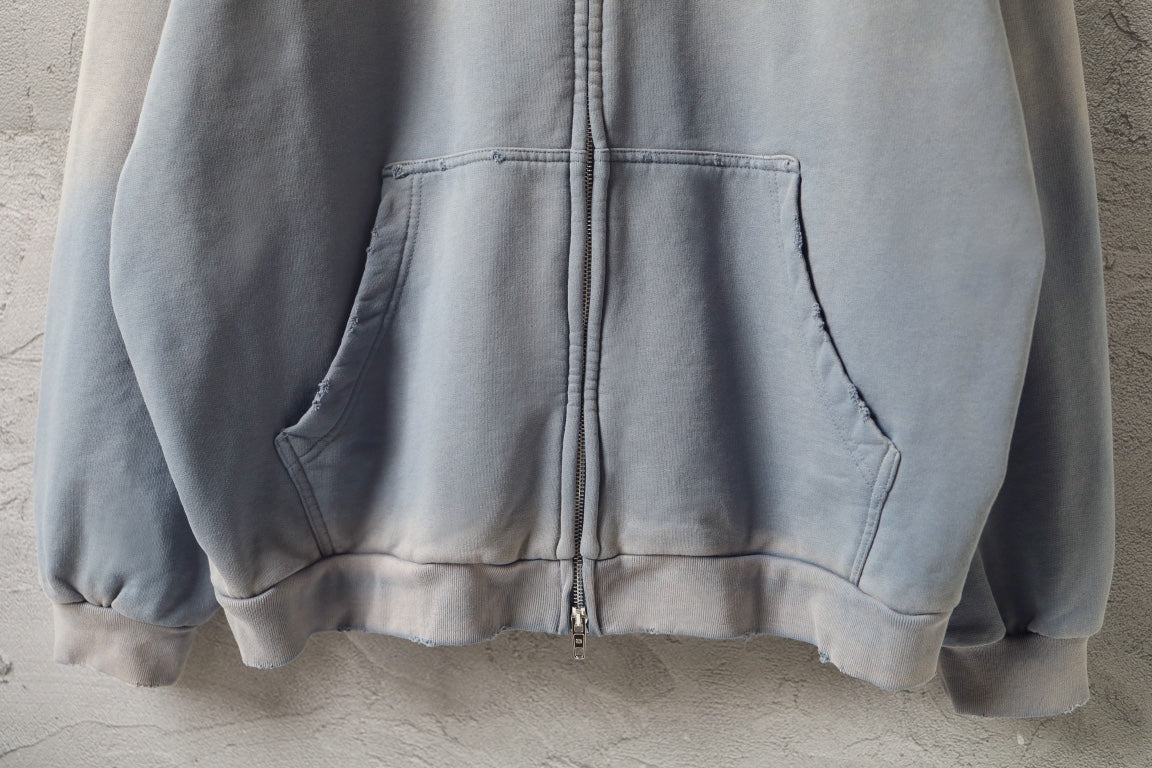 Light blue Balenciaga zip-up sweatshirt with two front pockets and ribbed cuffs