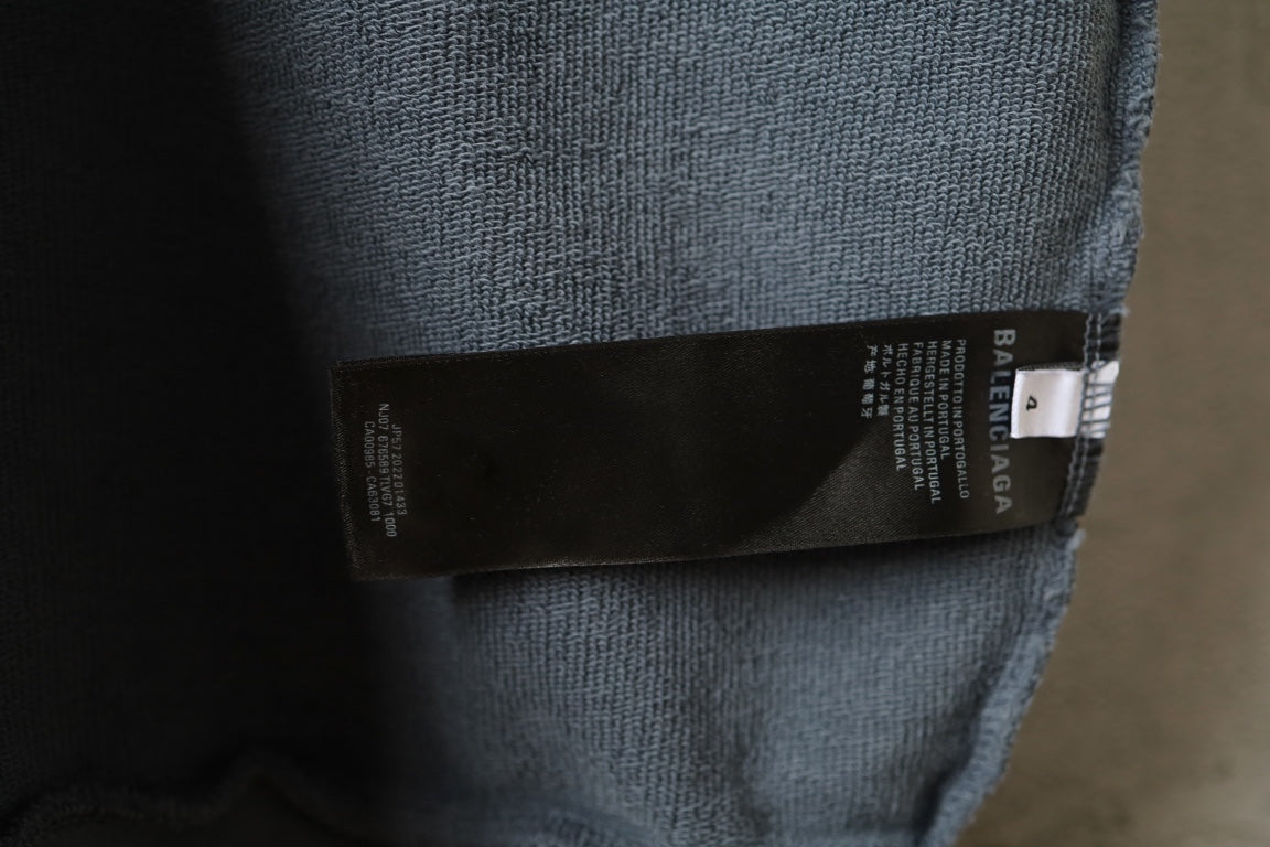 Light blue Balenciaga sweatshirt with inner care label on the hem