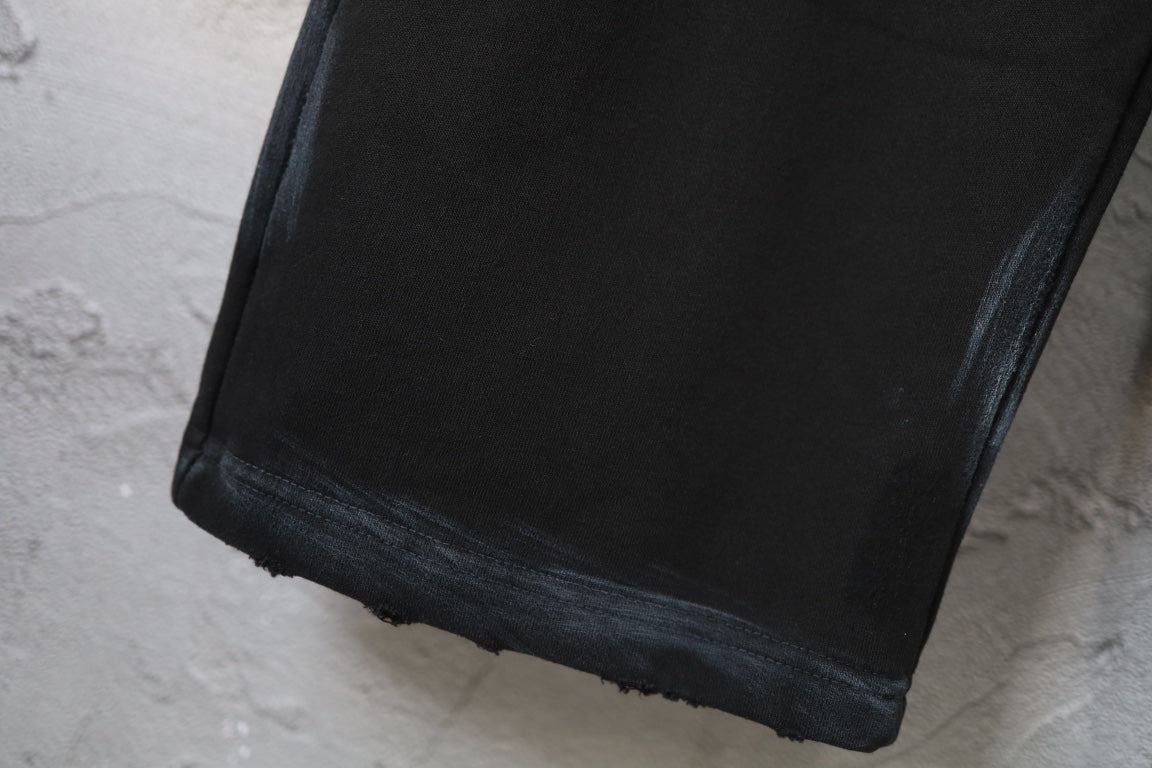 Black wide-leg pants hem with slight frayed edge at the bottom