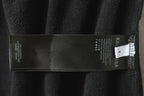 Black Balenciaga pants care label tag with size and textile information