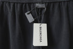 Black pants with Balenciaga logo patch and hanging size/brand tags
