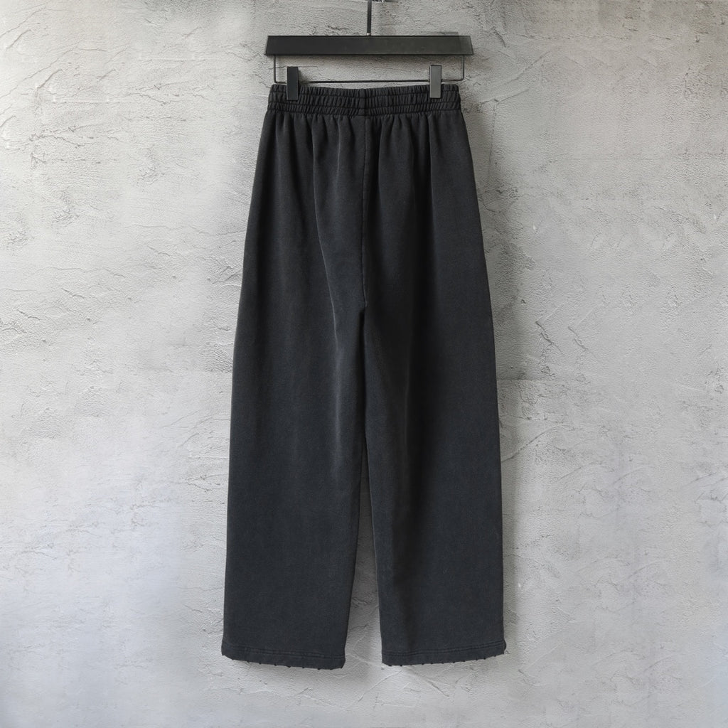 Black Balenciaga wide-leg pants with elastic waistband, clean front view