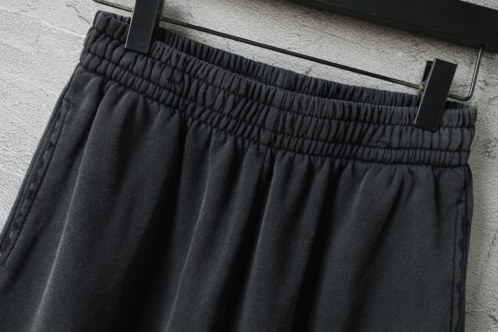 Black pants with elastic waistband and gathered ruched waistband detail