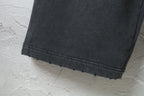 Black Balenciaga pants hem with straight cuffed bottom edge