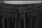 Black Balenciaga waistband close-up with gathered elastic detail