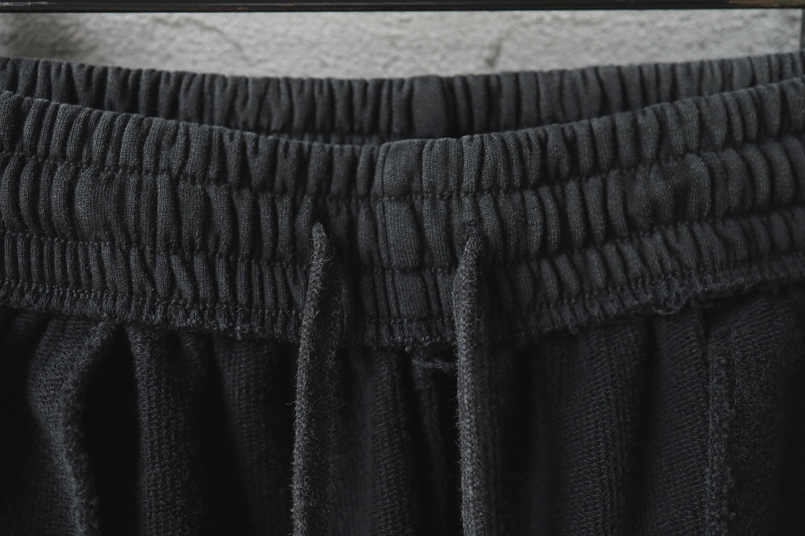 Black pants waistband with textured elastic and gathered pleats