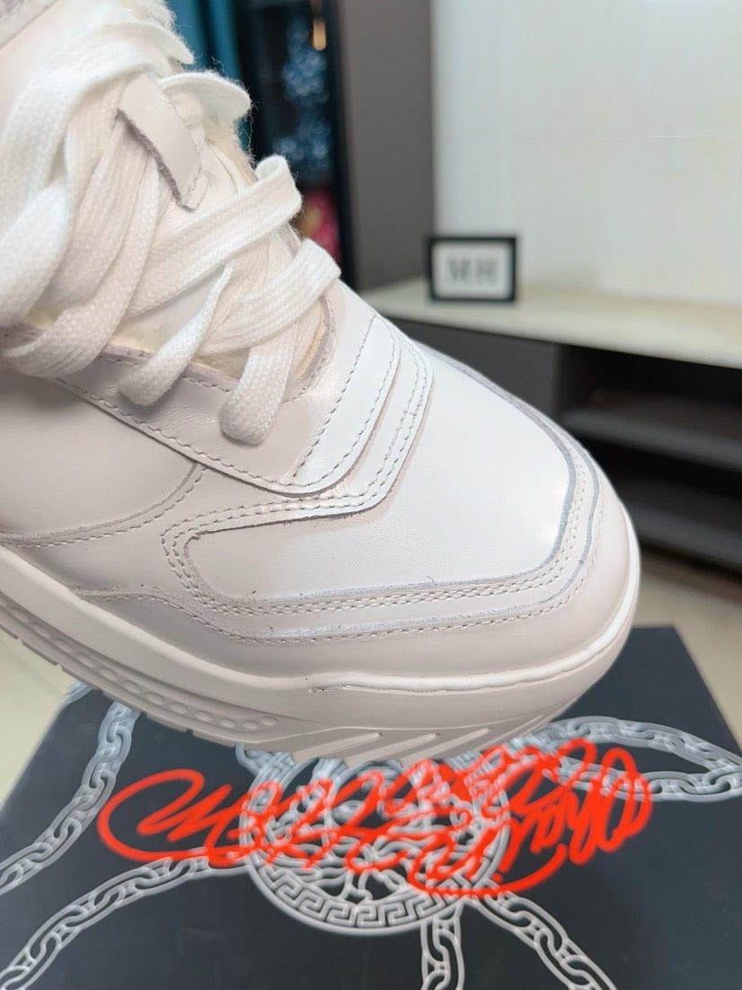 Versace white sneaker close-up of stitched panels and hook-and-loop strap