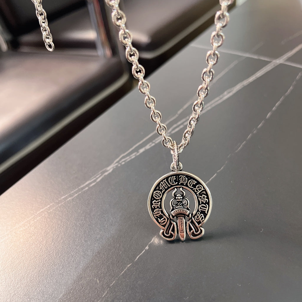Silver chain necklace with round emblem pendant