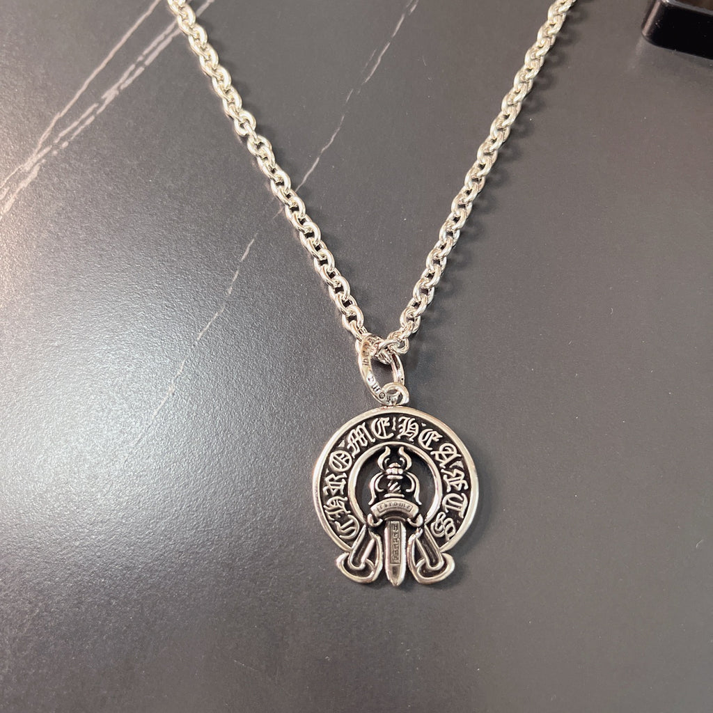 Silver chain necklace with round emblem pendant