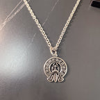 Silver chain necklace with round emblem pendant