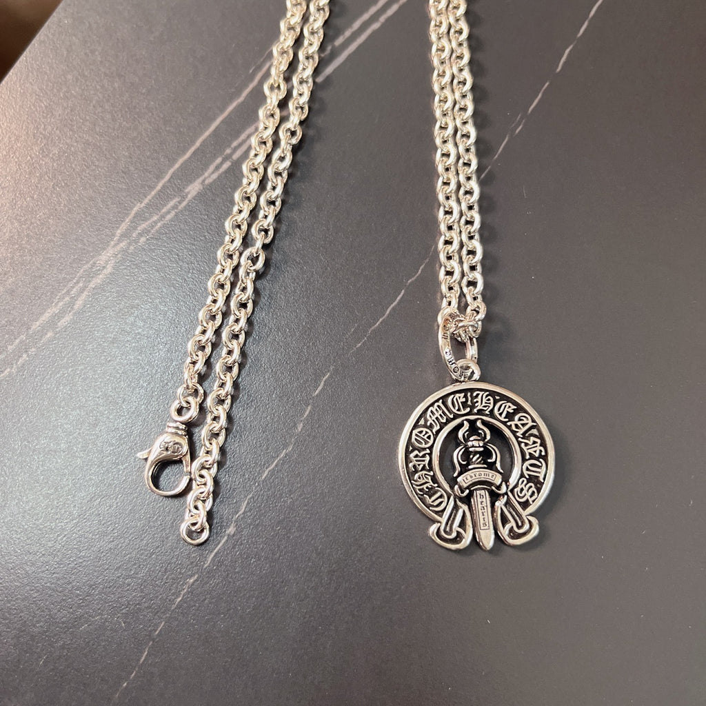Silver chain necklace with round emblem pendant