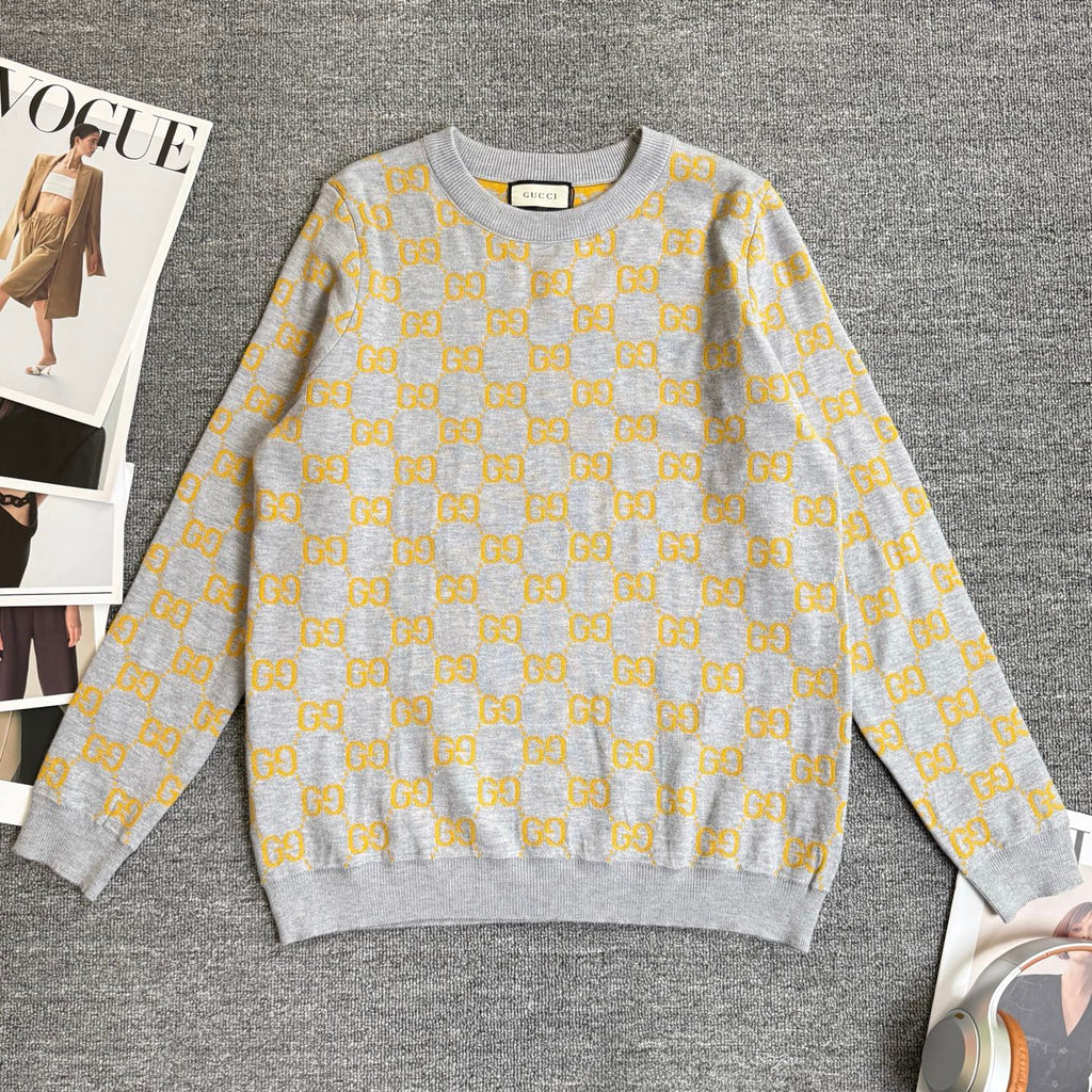 Long-sleeve knit sweater in heather gray with repeating yellow GG logo pattern