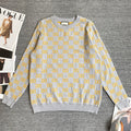 Long-sleeve knit sweater in heather gray with repeating yellow GG logo pattern