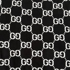 Black knit fabric with repeating white GG logo lattice pattern