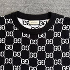 Black knit sweater crew neck with ribbed collar and repeating GG logo pattern