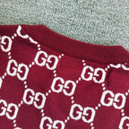 Burgundy Gucci sweater collar and shoulder area with white GG diamond pattern