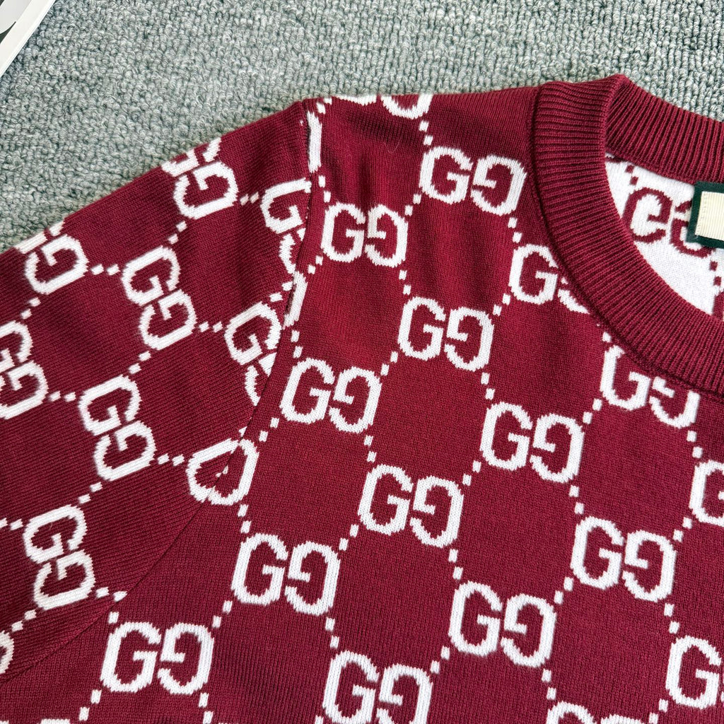 Burgundy Gucci sweater front with white GG diamond pattern across the chest