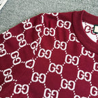 Burgundy Gucci sweater front with white GG diamond pattern across the chest