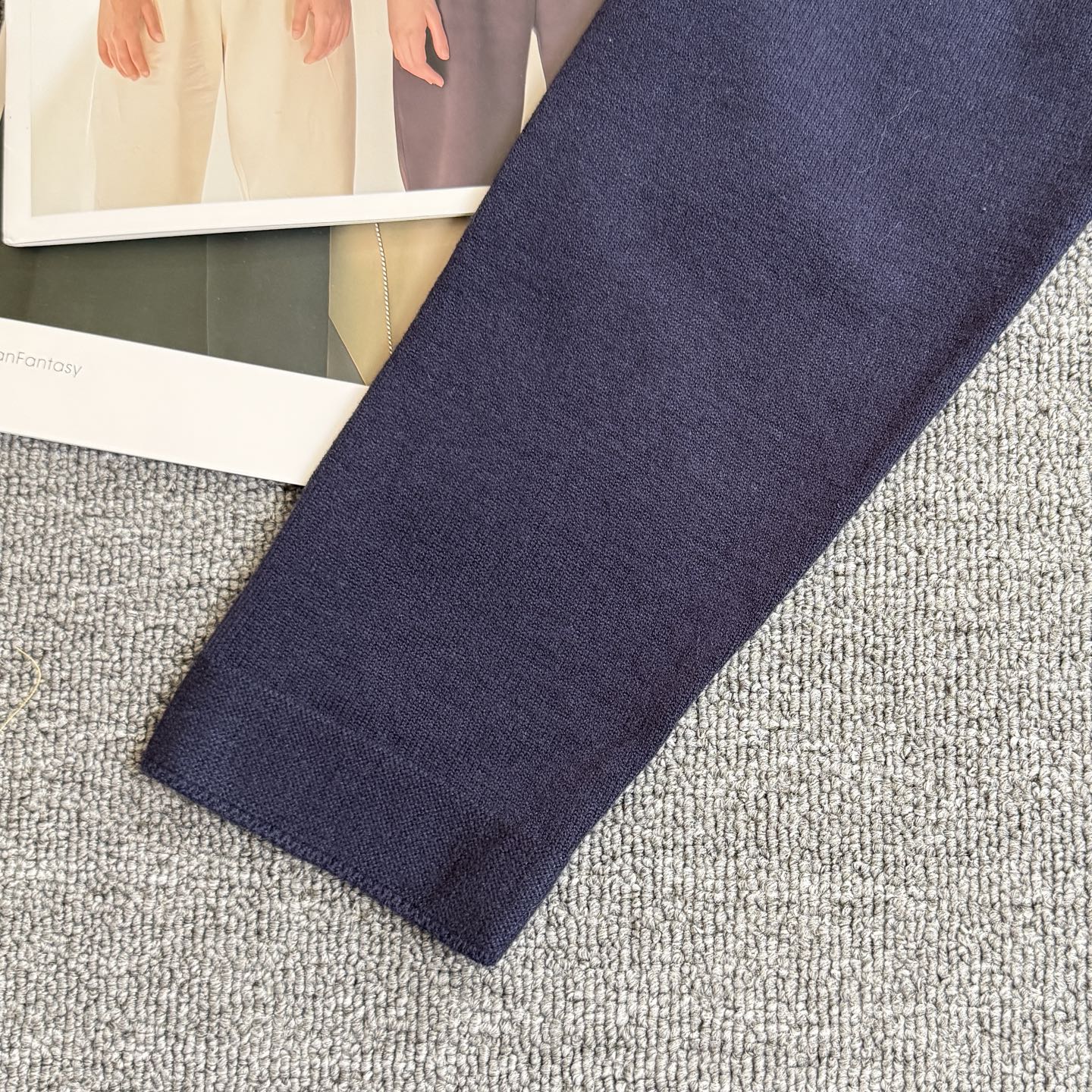 Navy Dior cardigan sleeve with knit cuff, plain fabric with no visible graphics