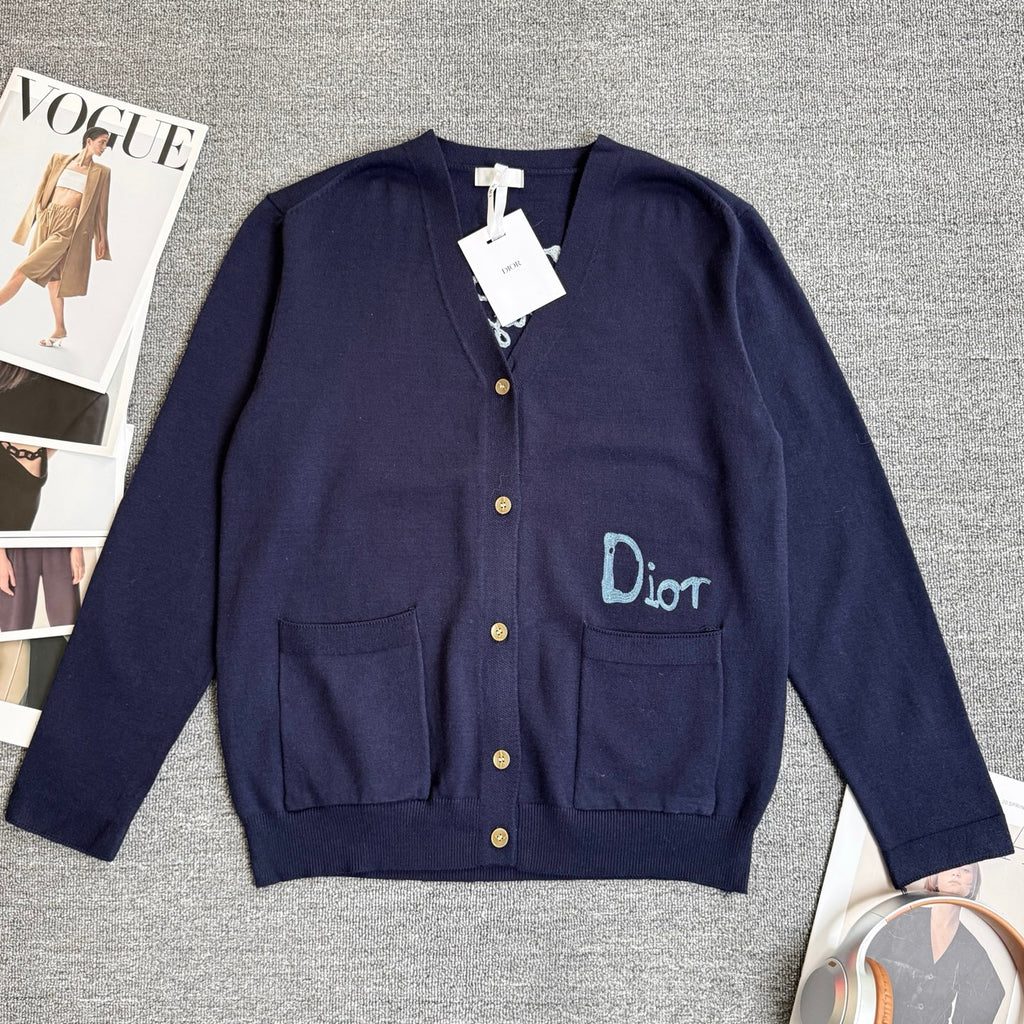 Navy Dior cardigan sweater with front button placket, patch pockets, and Dior logo