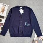 Navy Dior cardigan sweater with front button placket, patch pockets, and Dior logo