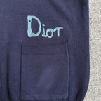 Navy Dior cardigan chest pocket with embroidered "Dior" logo on the left side