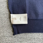 Navy Dior cardigan size label on inner neck, with ribbed cuff at hem
