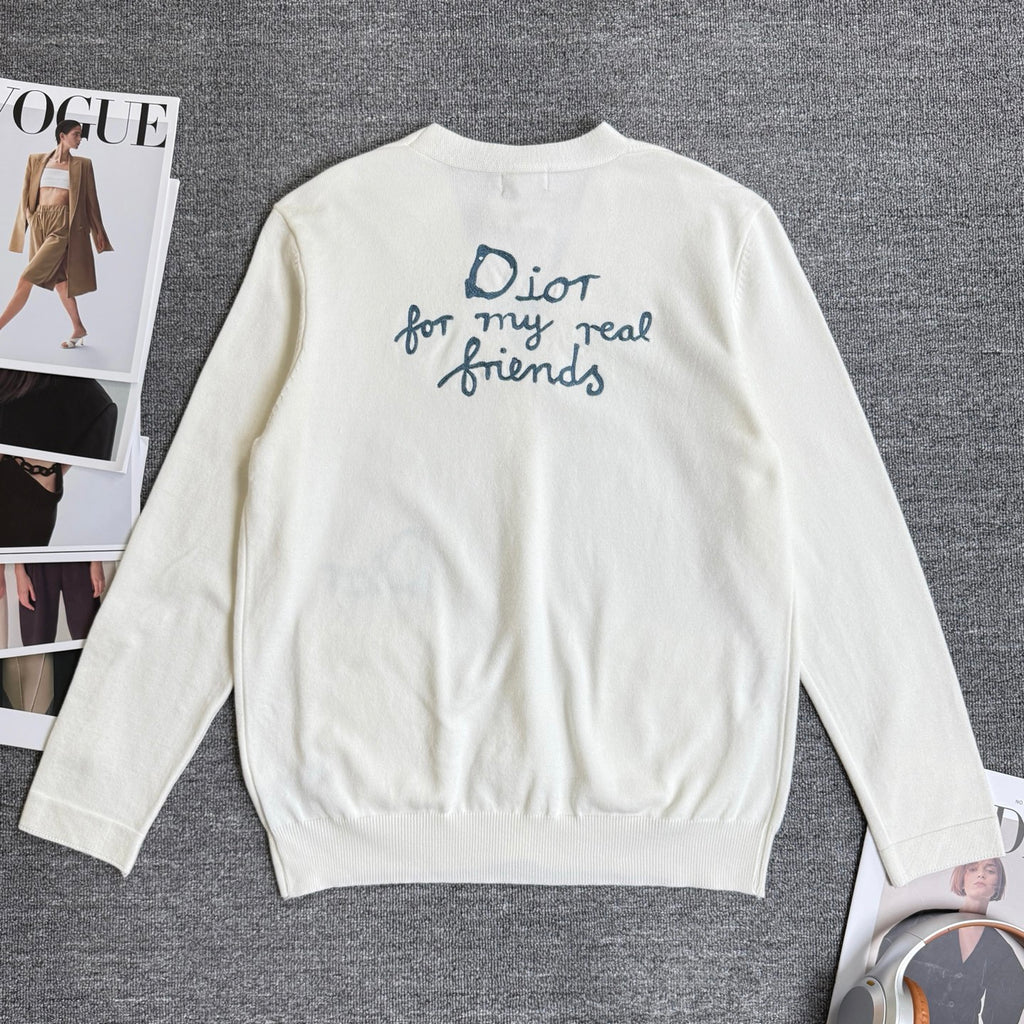 White long-sleeve cardigan sweater, back view with blue slogan embroidery