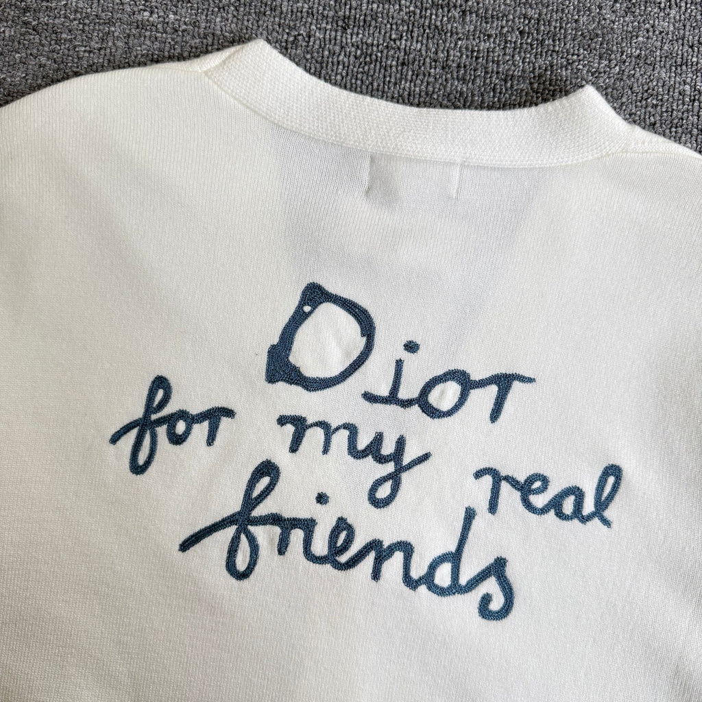 White cardigan sweater with blue "Dior for my real friends" embroidery