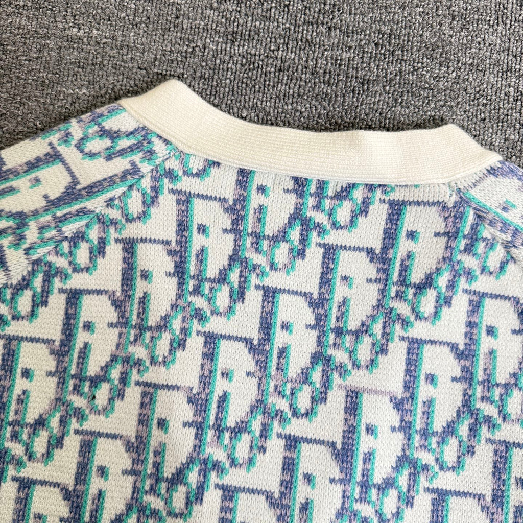 Ribbed crew collar on light blue and white patterned knit cardigan