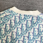 Ribbed crew collar on light blue and white patterned knit cardigan