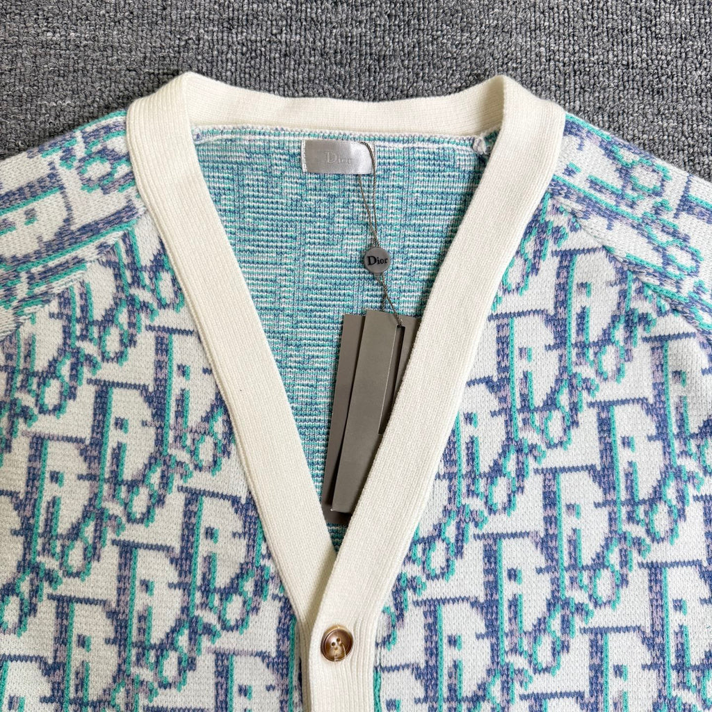 Knit cardigan V-neck with cream trim and button placket, light blue patterned fabric